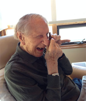Golub with Leeuwenhoek (copy) microscope on his 100th birthday